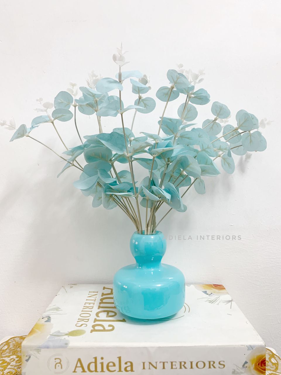 Eucalyptus flower In Blue Glass Vase image
