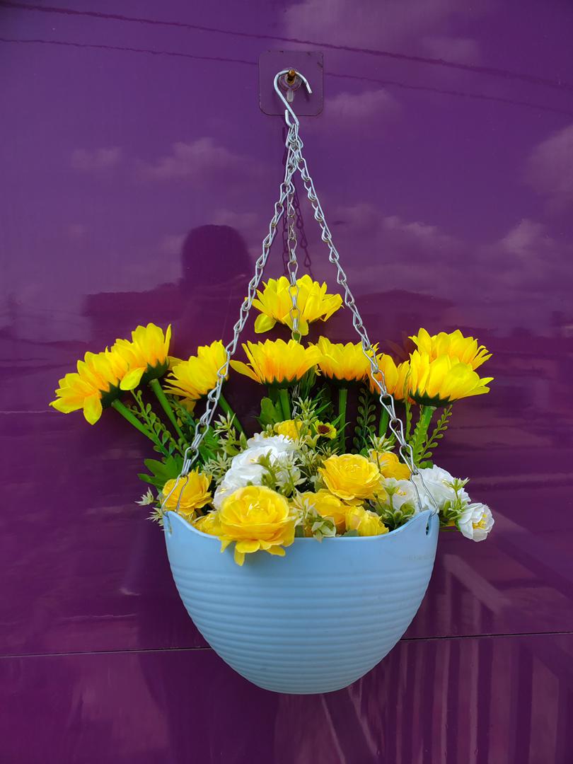 Artificial Flower In Hanging Plastic Vase image