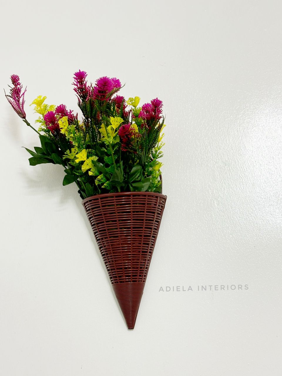 Artificial Flower In Plastic Wall Vase image