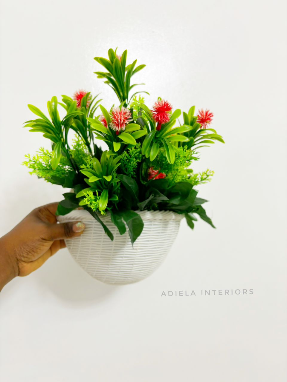 Artificial Flower In Plastic Wall Vase image