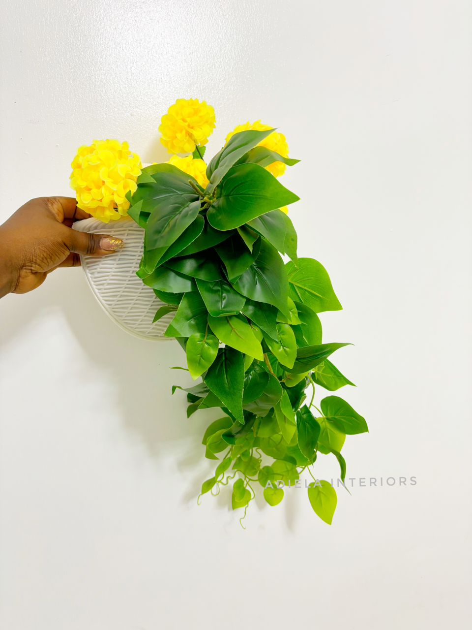Artificial Flower In Plastic Wall Vase image