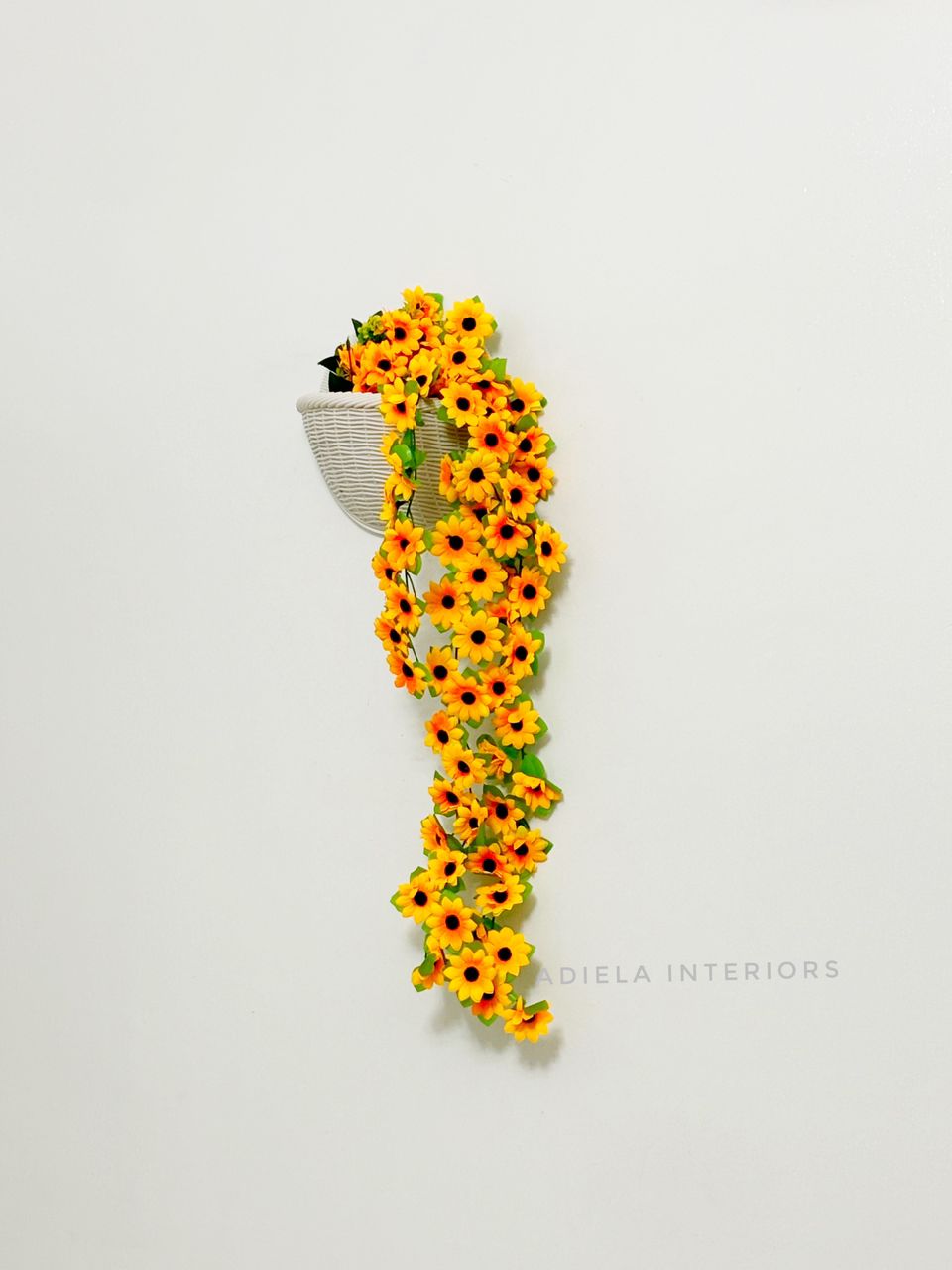 Artificial Dropping Sunflower In Plastic Wall Vase Image