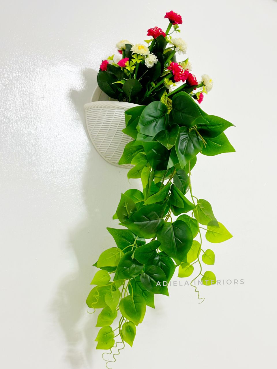 Artificial Flower In Plastic Wall Vase image